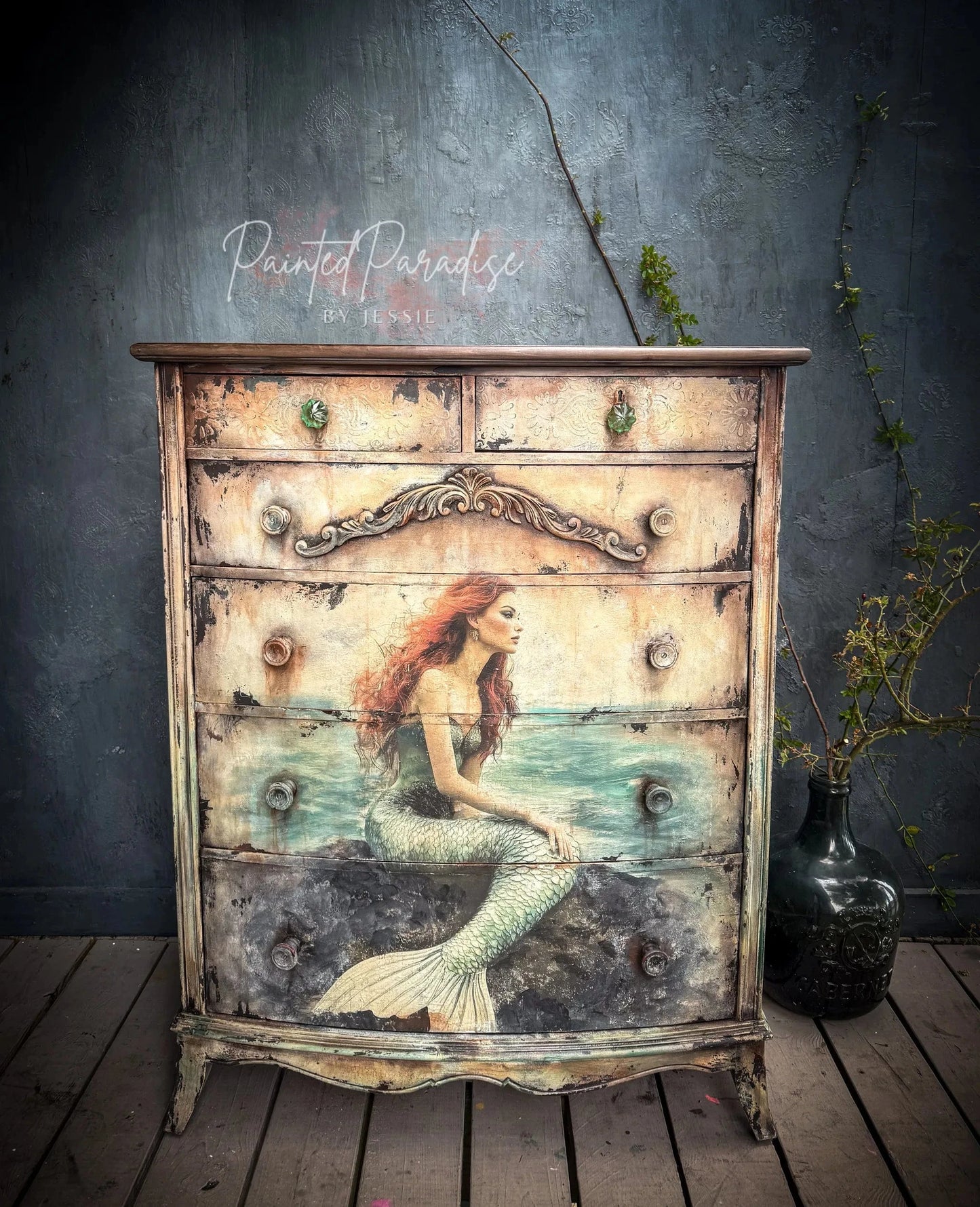 Close-up of the crinkled, semi-transparent tissue paper with intricate sea-inspired patterns in shades of blue and beige.