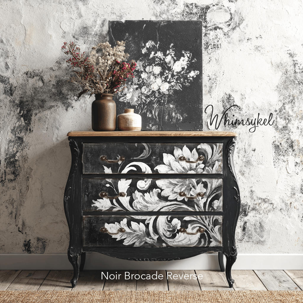 Close-up of noir brocade pattern showcasing intricate gold threading and rich fabric texture at a diagonal angle