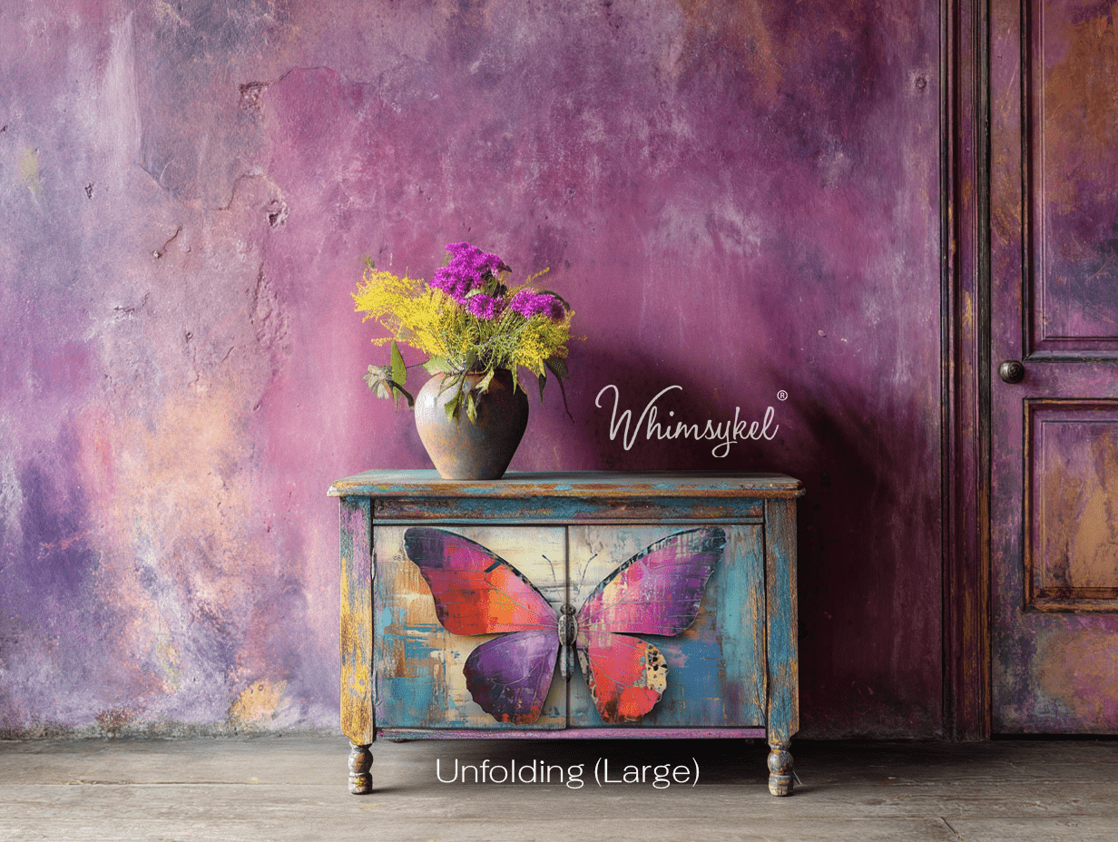 Close-up of layered, torn decoupage tissue paper with vibrant floral patterns and textured edge detail