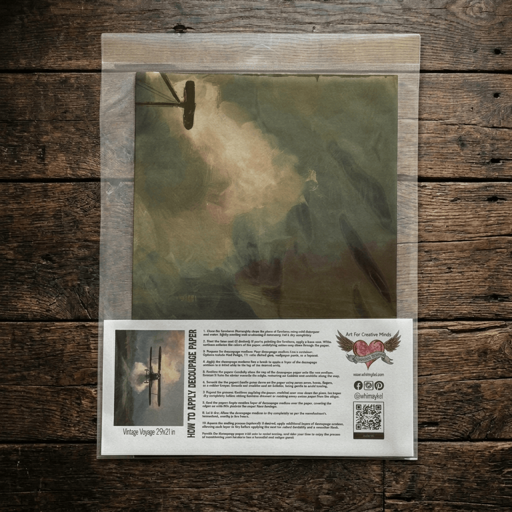 A packaged decoupage tissue paper called Vintage Voyage with an attached printed instruction card, product placed on a rustic dark wood surface. 