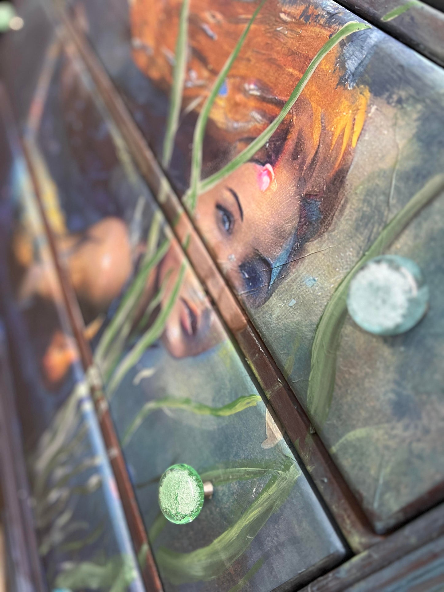 Close-up of vibrant mermaid design with shimmering teal and purple tissue layers, highlighting intricate textured pattern on